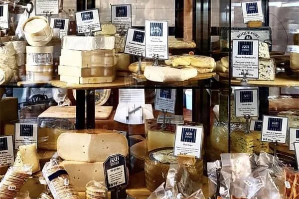 A selection of cheeses in the Kitchen & Butcher deli display
