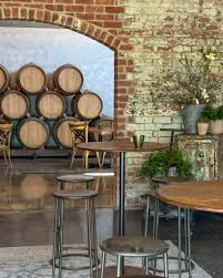 Wine barrels and tables in Punt Road Wines’ cellar door