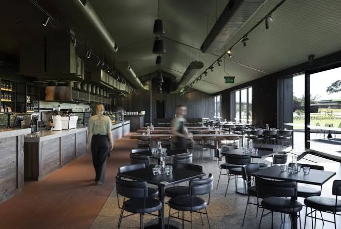 Quarters restaurant at Hubert Estate, with contemporary dining tables and views through large windows